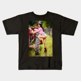 Sexy farmer girl in hat near the tractor Kids T-Shirt